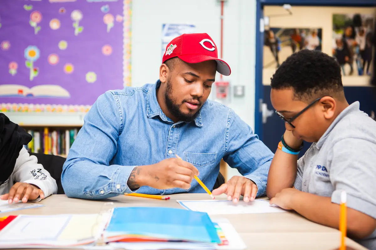 Tutor studying alongside students